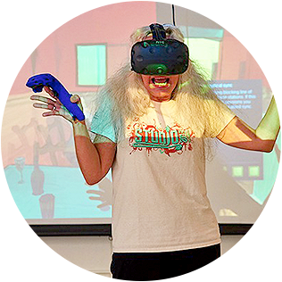 woman wearing vr mask and holding controller in front of a projection screen