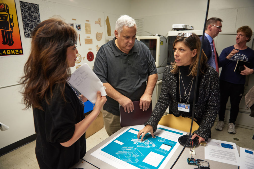 faculty looking at design blueprint