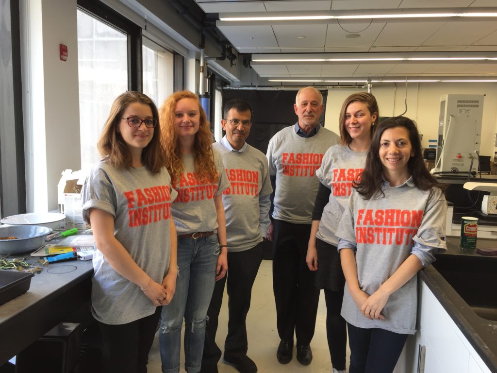 FIT students and professors wearing Fashion Institute shirts