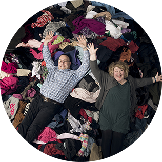 man and woman in pile of clothing