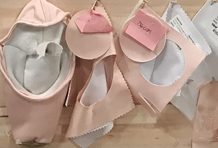 display of different parts of ballet slippers