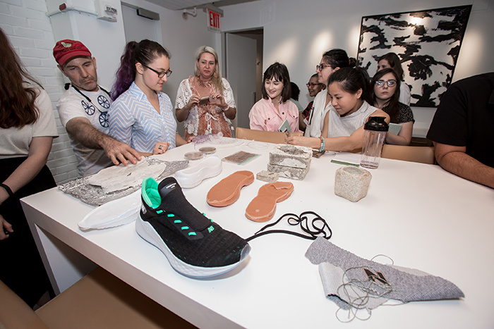 FIT and visiting students from MIT look at shoe design during presentation at the Brooklyn Navy Yards