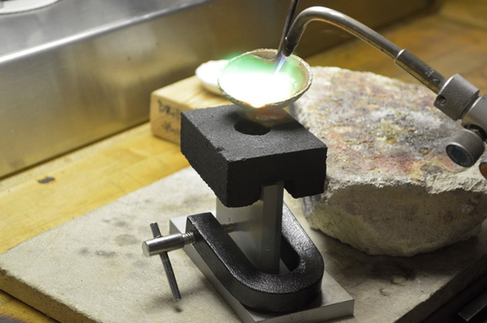 metal jewelry in process of production with welding machine