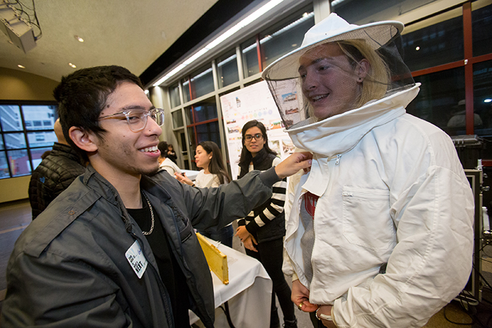 person wearing protective beekeeper suit at the Sustainability Conference at FIT