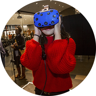 woman wearing VR mask at Sustainability Conference at FIT