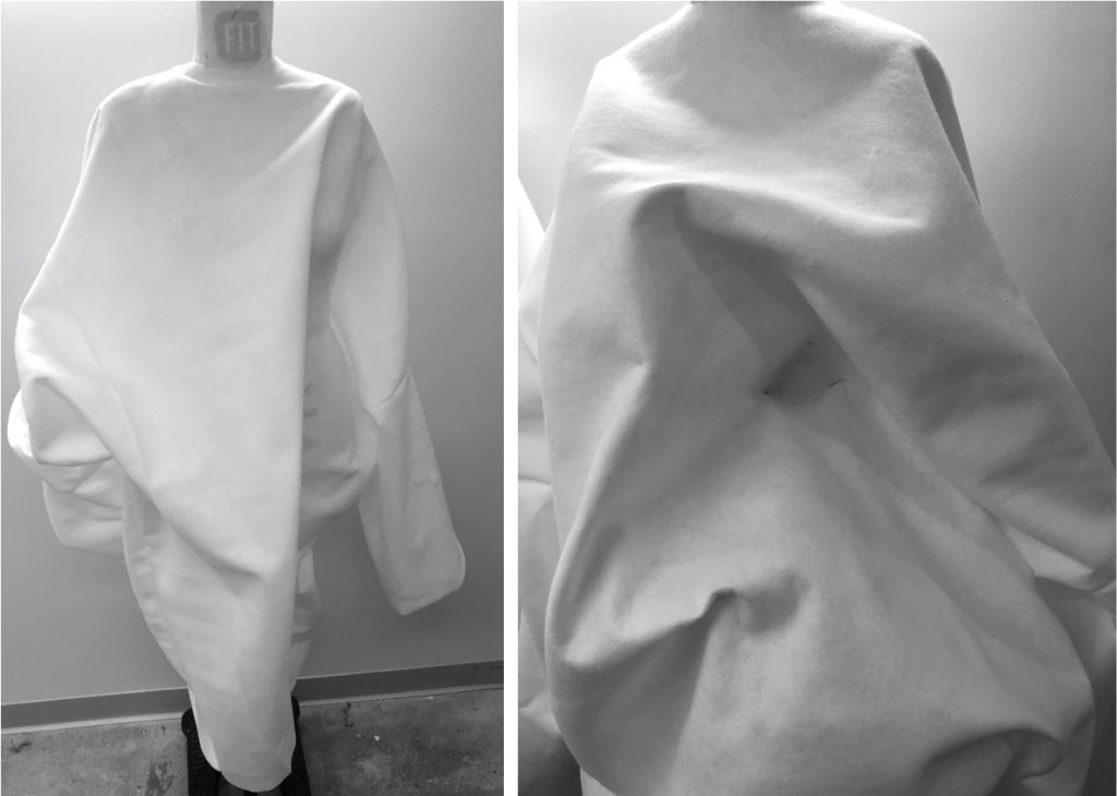 white fabric draped over a dress form