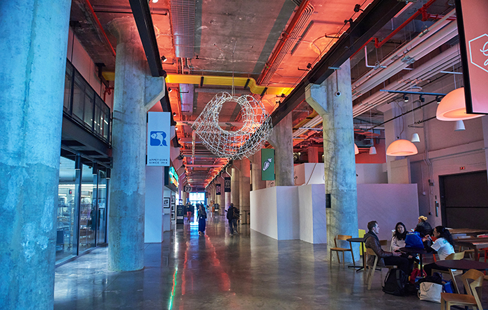 FIT's new space at the Brooklyn Navy Yard with large columns and open area with seating