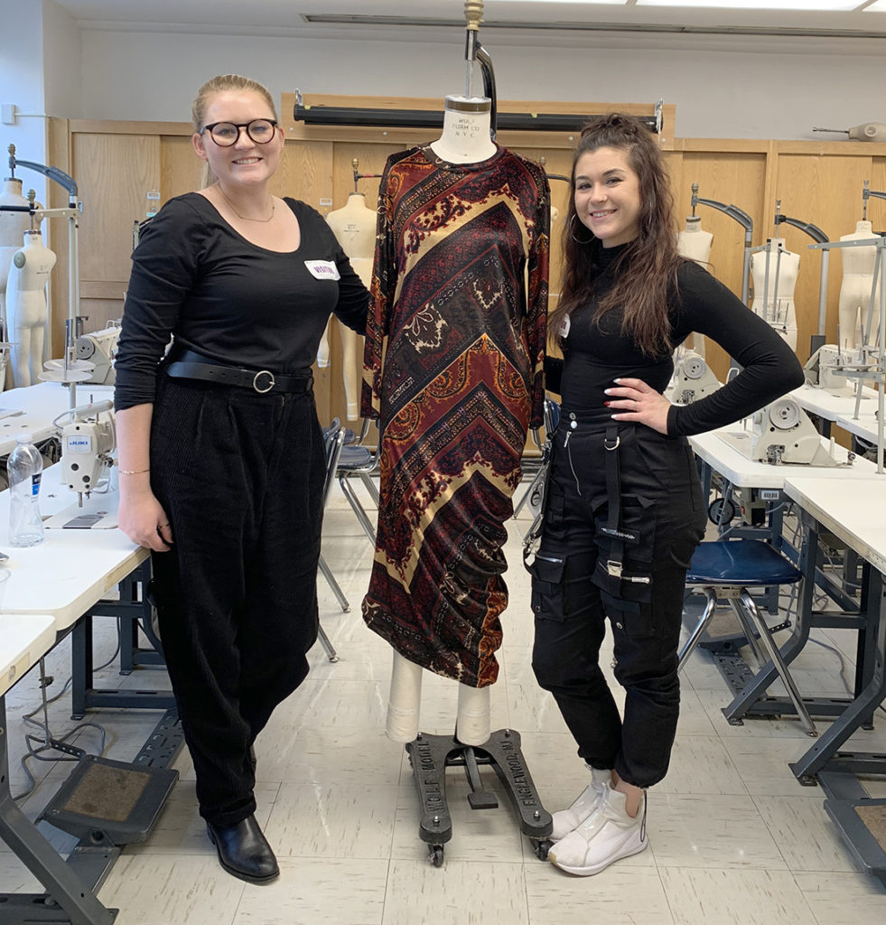 2 students with dress on mannequin designed for product in a day event at FIT